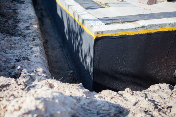 Professional Interior Drainage System technician working in Roslyn Heights, NY